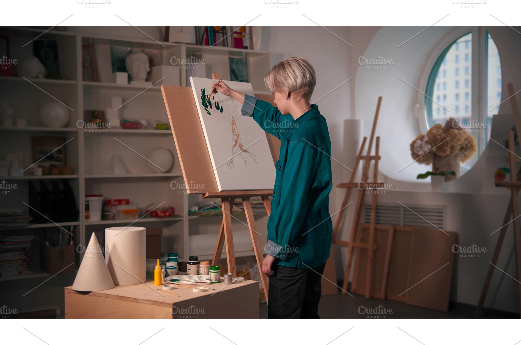 A young woman artist coloring her, a Person Photo by Barcelona_dreams