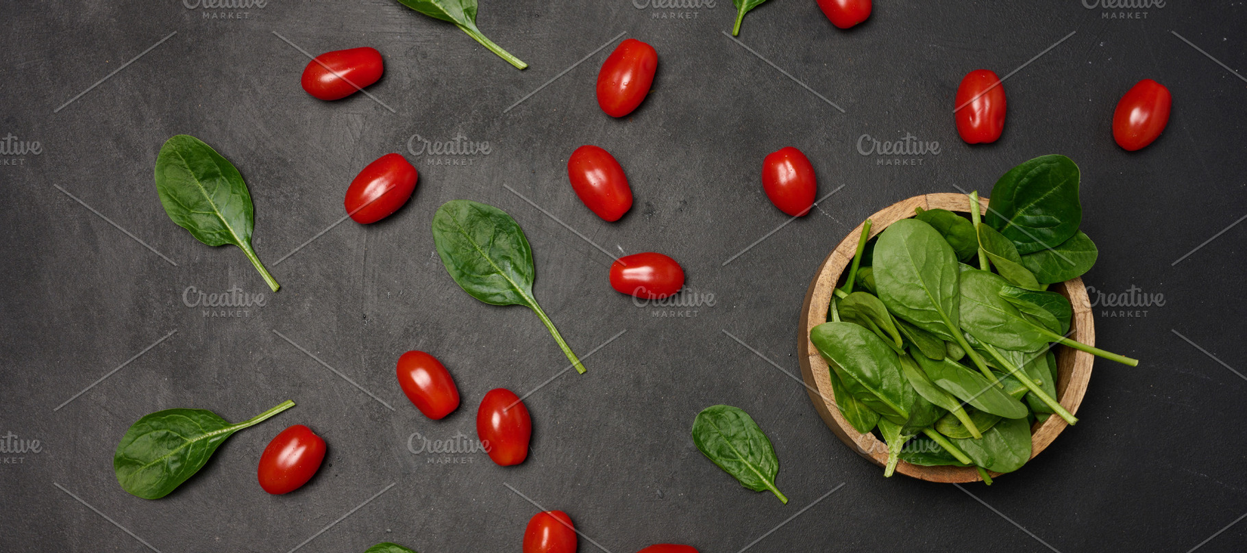 A wooden bowl filled with fresh spinach leaves surrounded by sca, a Food & Drink Photo by ndanko