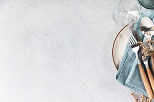Rustic Table Setting with Blue Linen and Wooden Cutlery on Light, a Food & Drink Photo by Natalia Klenova's Shop