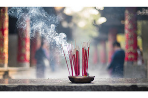 Burning incense sticks releasing, a Background Photo by Igor Tichonow