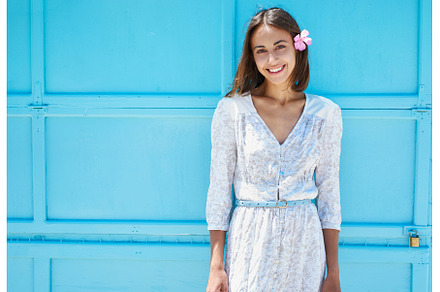 Brunette woman on bright blue, a Person Photo by vitaliymateha photography