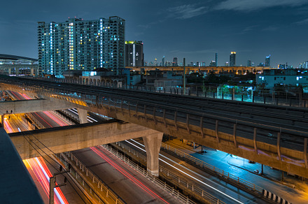 Sky train railway in metropolis in night life. Transportation co, an Architecture Photo by Ministocker