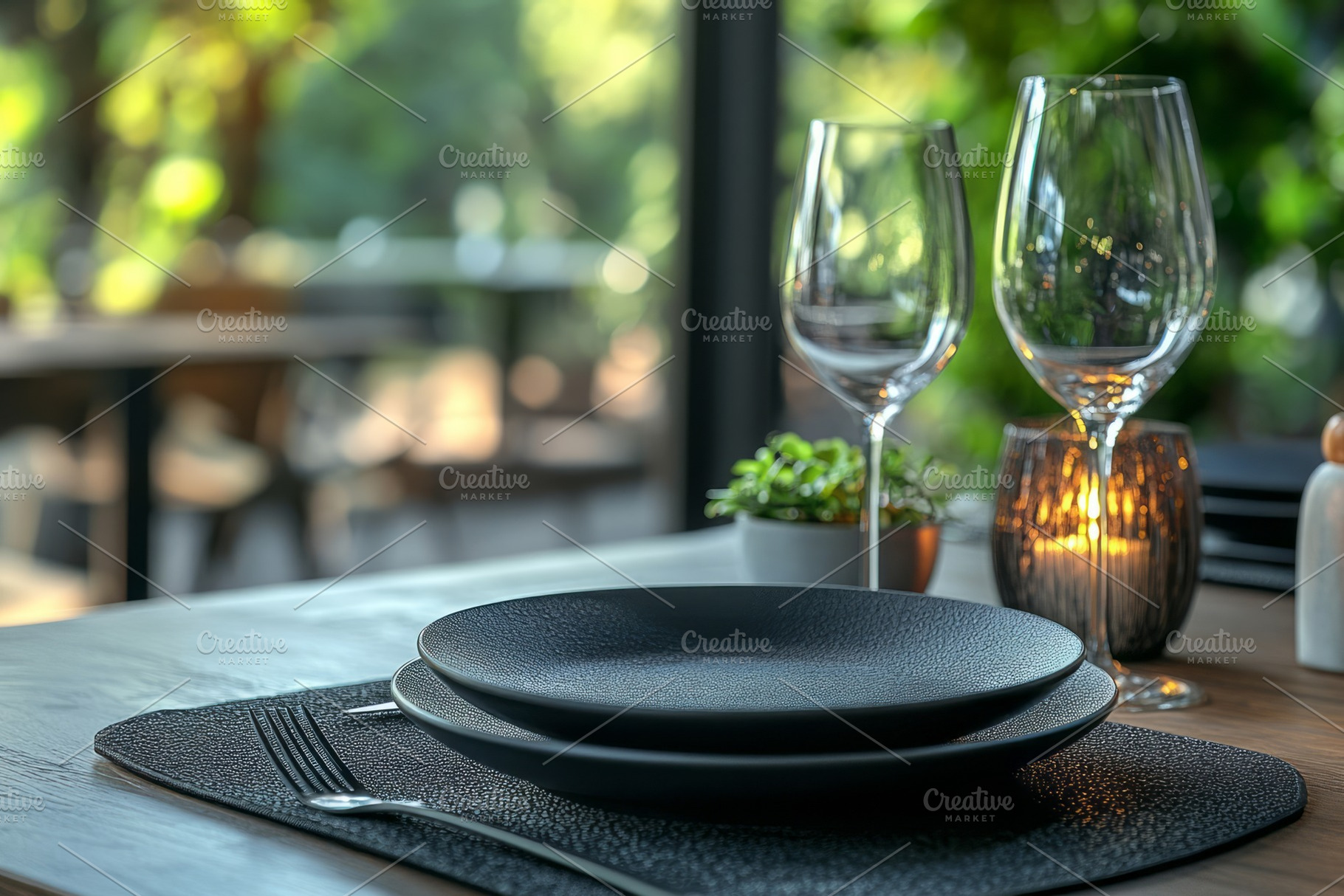 Elegant black dinnerware set on a rustic table, complemented by crystal glasses, a Background Photo by ImageMir