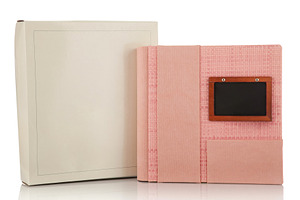 Pink photo album with wooden frame for title and its box on white background, an Abstract Photo by Antonio Gravante Market