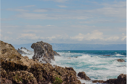 ocean waves that will hit the rocks, a Nature Photo by Herlan Khenz