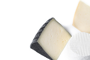 Different cheeses with nuts, figs and grapes, a Food & Drink Photo by etorres69