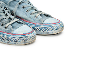 Pair of blue sneakers on white stock photo containing sneakers and gumshoes