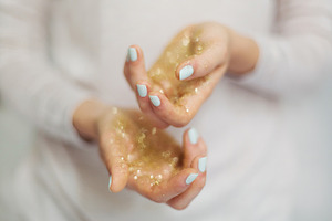 Gold glitter in hands