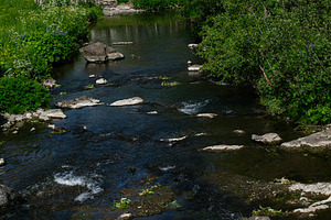 Scenic river landscape with rocks and vegetation in Mosfellsbær, Iceland, duri, a Photo by AS photostudio