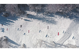 Ski lift moving uphill over snowy, a Nature Photo by Goinyk