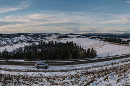 Asphalt road curve and winter beginning in Mountains, Ukraine, C, a Nature Photo by YuriyB