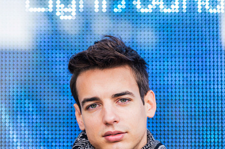 Portrait of stylish handsome young man with coat standing outdoo, a Person Photo by RF Images
