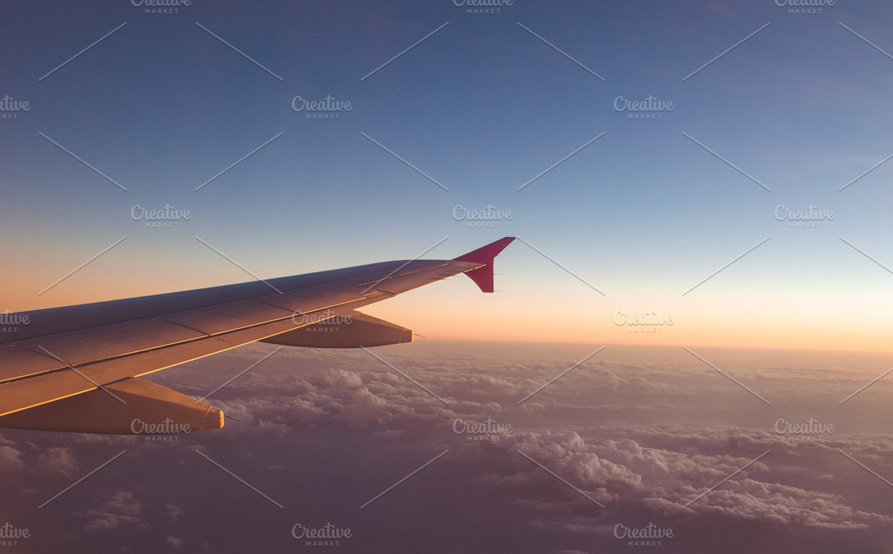 Airplane wing with sunrise featuring above, aircraft, and airplane, a Transportation Photo by Alexandrulucian