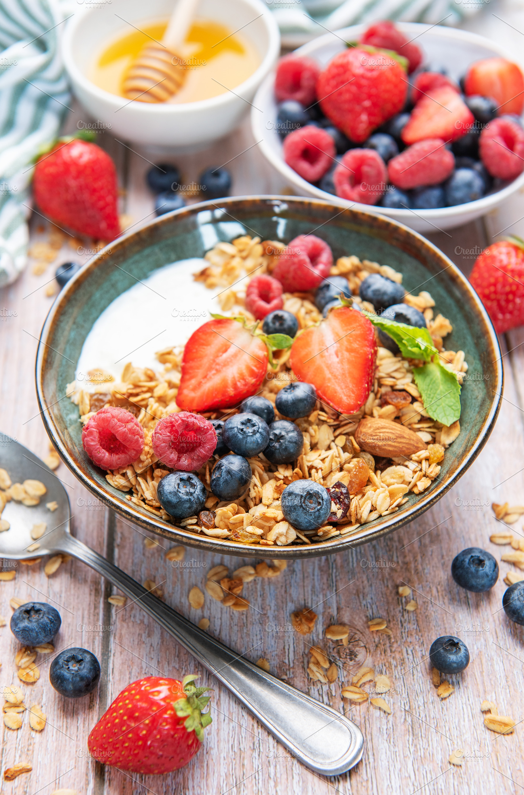 Healthy yogurt granola bowl with fresh berries, a Food & Drink Photo by Olena Rudo
