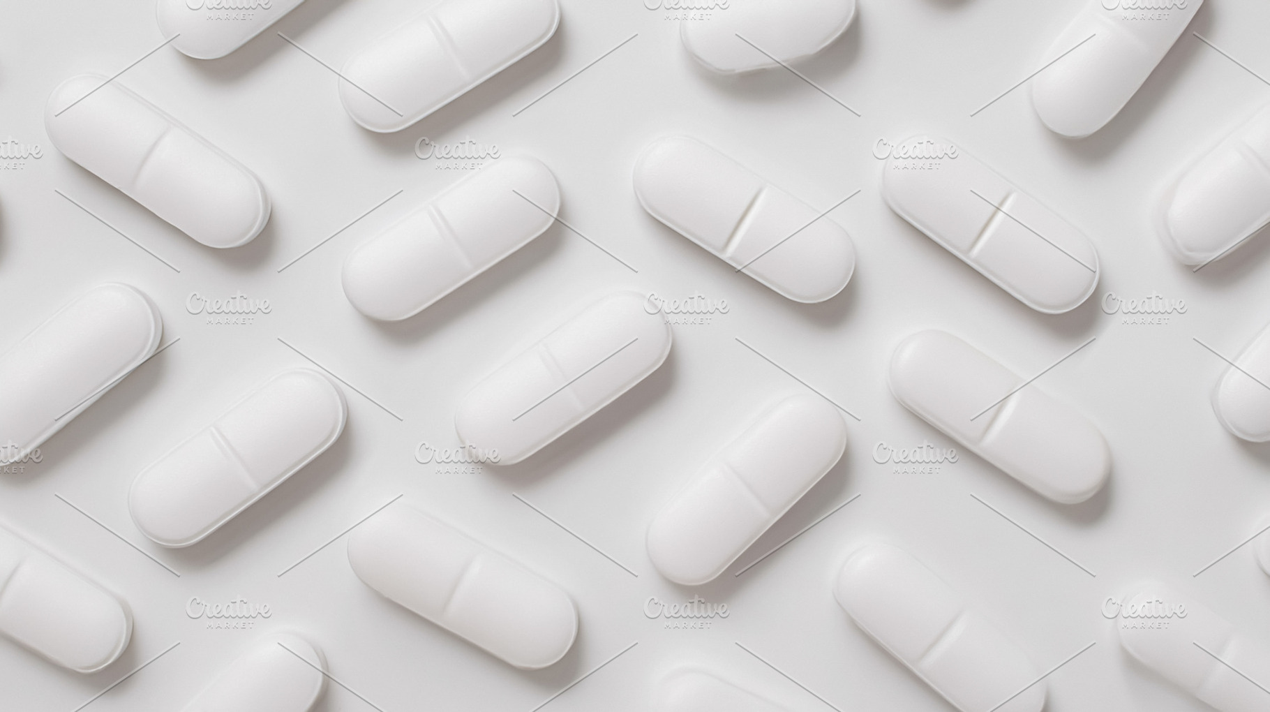 White oval pills scattered on a bright uniform surface represent, a Photo by Studio ANNA
