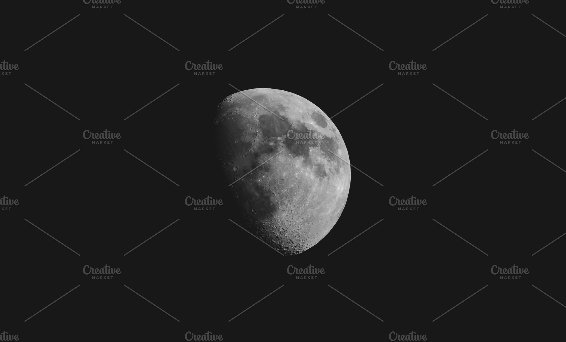 Half moon seen with a telescope, a Photo by WorldOfPhotos