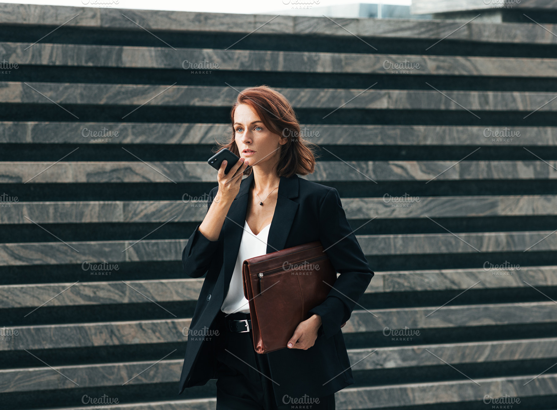 Middle-aged businesswoman recording, a Person Photo by Artem Varnitsin