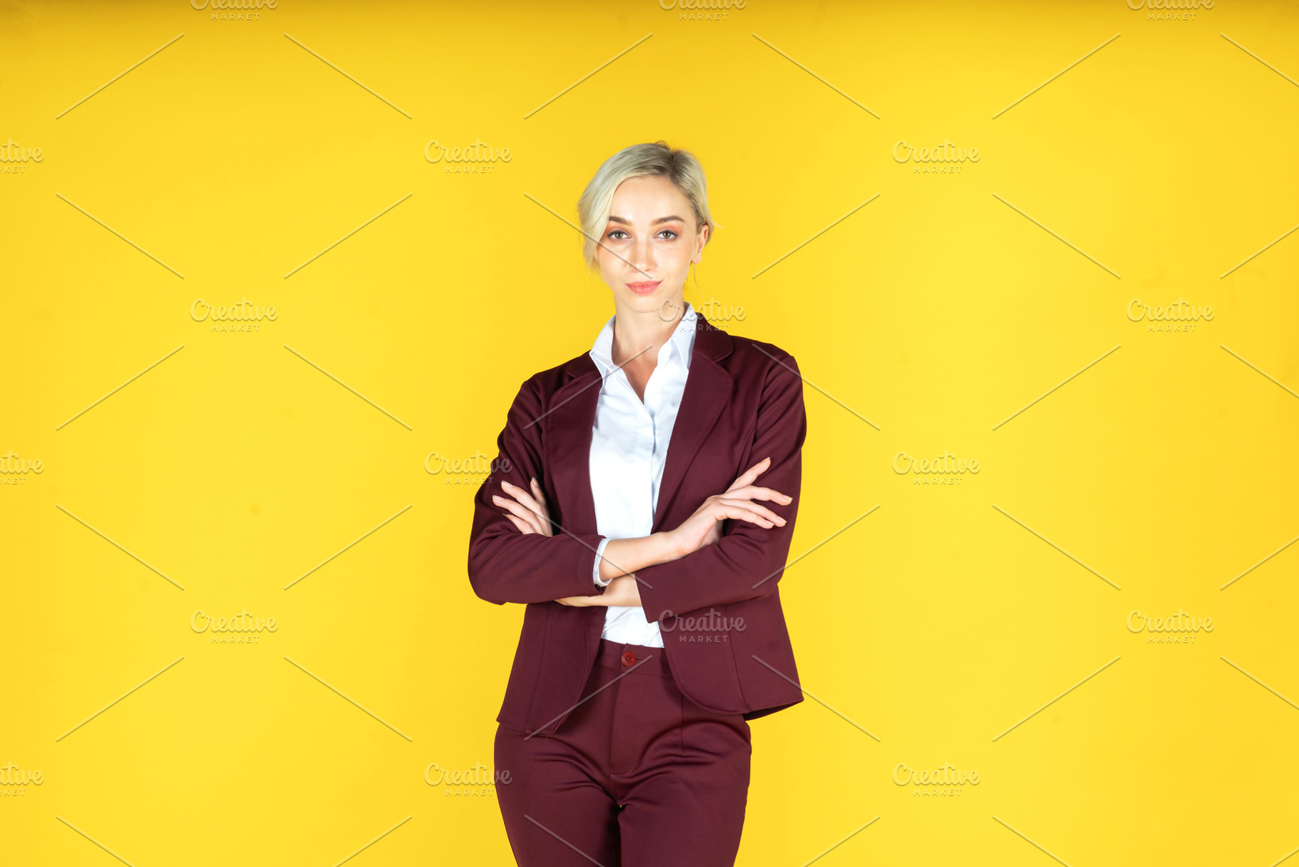 Portrait of smiling business woman isolated on yellow background, a Person Photo by Art_Photo