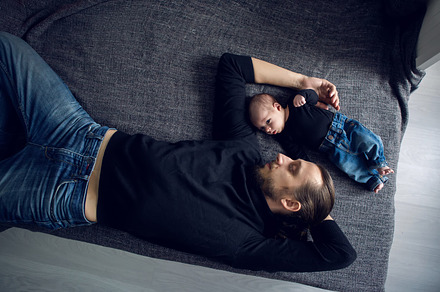 Father and son lying stock photo containing baby and father, a Person Photo by SaulichPhoto