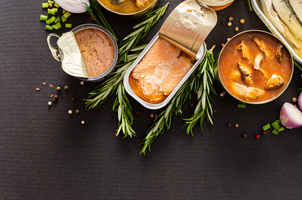 Open tin cans with canned fish, a Food & Drink Photo by Pandateam