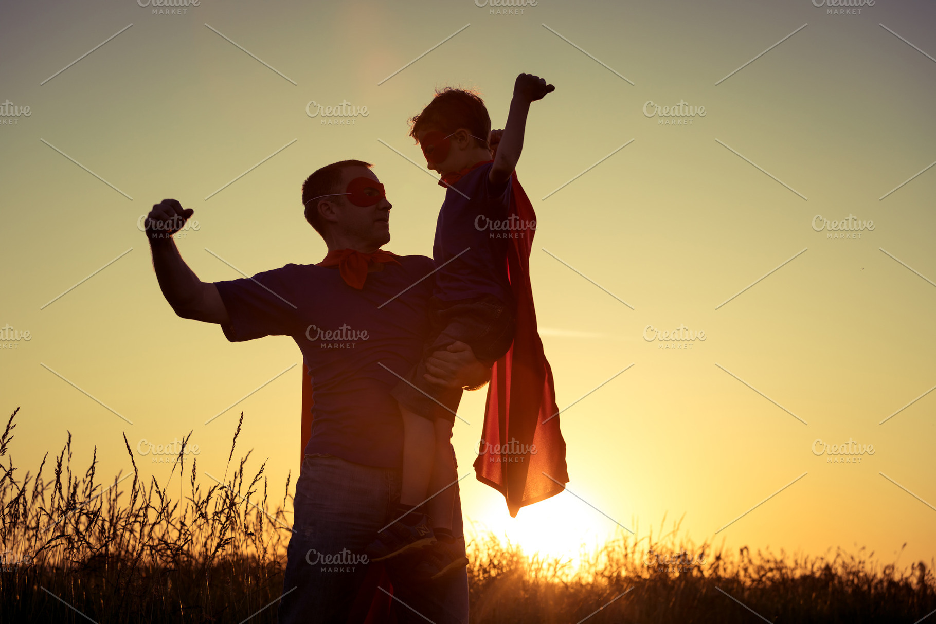 Father and son playing superhero containing active, adventure, and boy, a Person Photo by altanaka