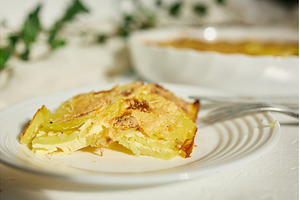 Creamy potato dish served in a cozy, a Food & Drink Photo by IlliaBondarPhotography