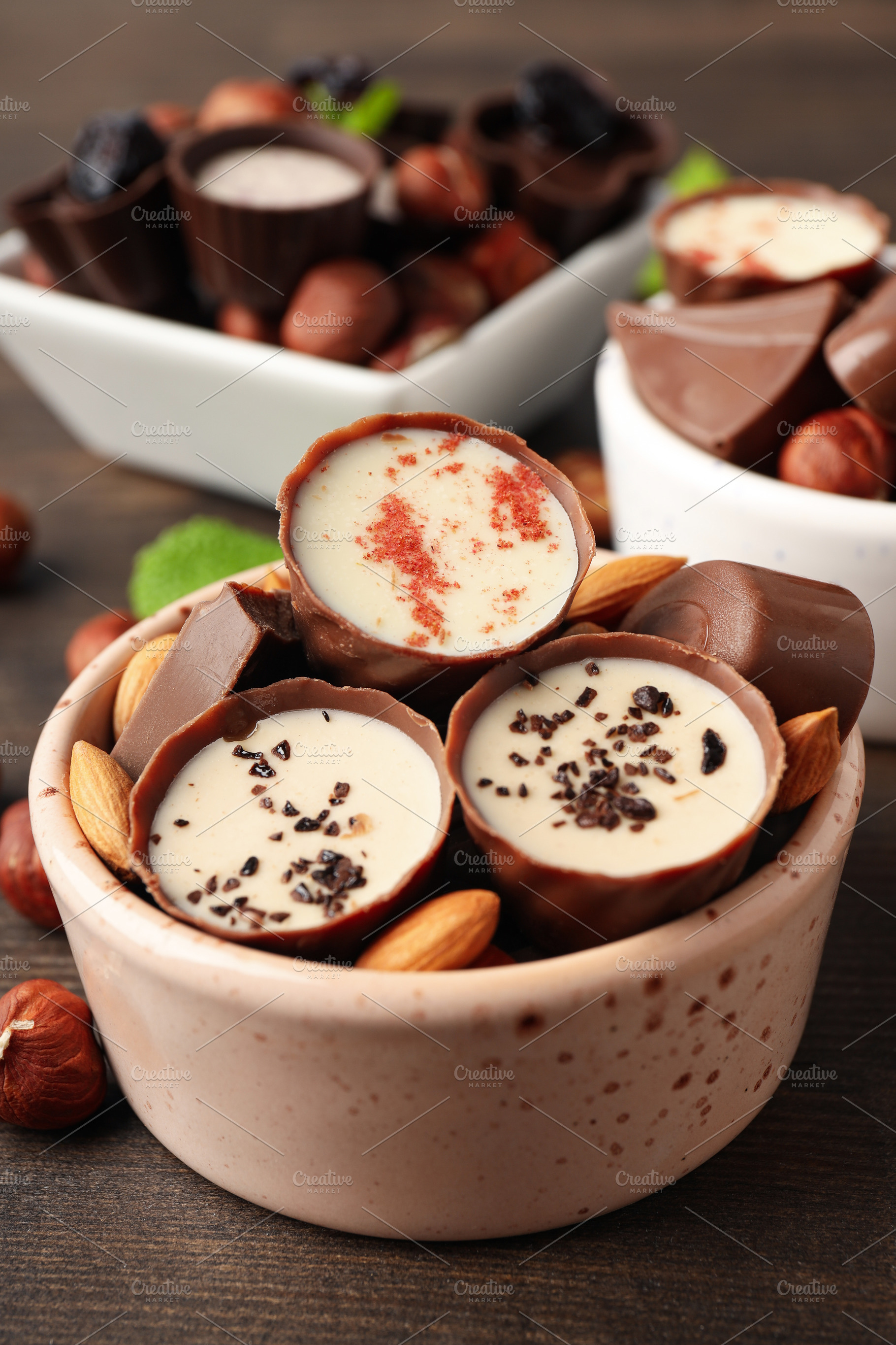 Concept of sweets with chocolate candies on wooden background, a Food & Drink Photo by AtlasStudio PRO