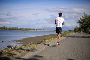 Man Jogging on Beach Road, a Sports & Recreation Photo by bastera