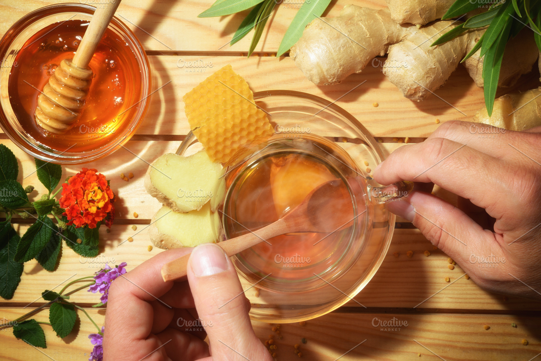 Person preparing a natural infusion of honey and ginger, a Food & Drink Photo by Davizro's Market