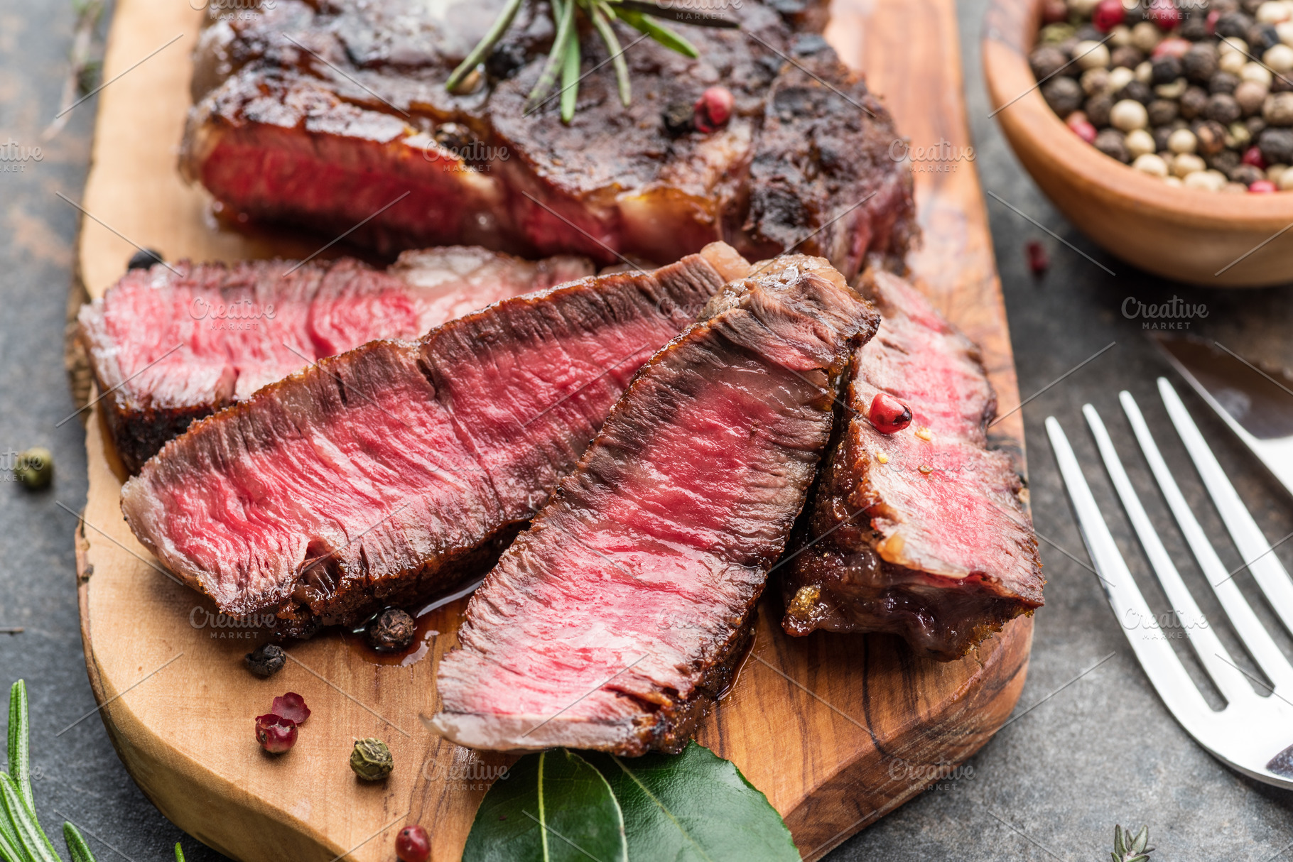 Medium rare Ribeye steak with herbs, a Photo by Volff