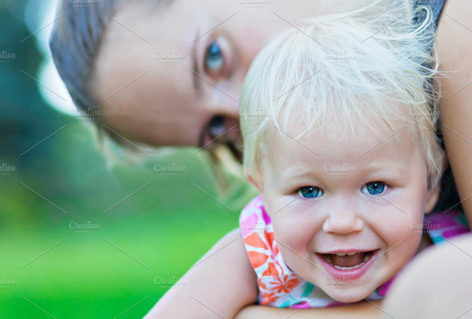 Baby and mother playing, a Photo by saiko3p