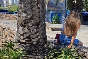 Teen wonan sitting at public park, punta del este city, maldonad, an Architecture Photo by DanFLCreativo