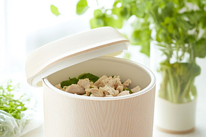 Food waste bin filled with chicken b, a Photo by Dvoevnore photos