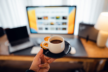 Coffee cup,hand holding a cup of coffee at the desk, a Food & Drink Photo by Art Rachen