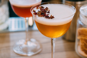 Garnished cocktail refreshing liquor mix table, a Food & Drink Photo by Photo Drive Studio