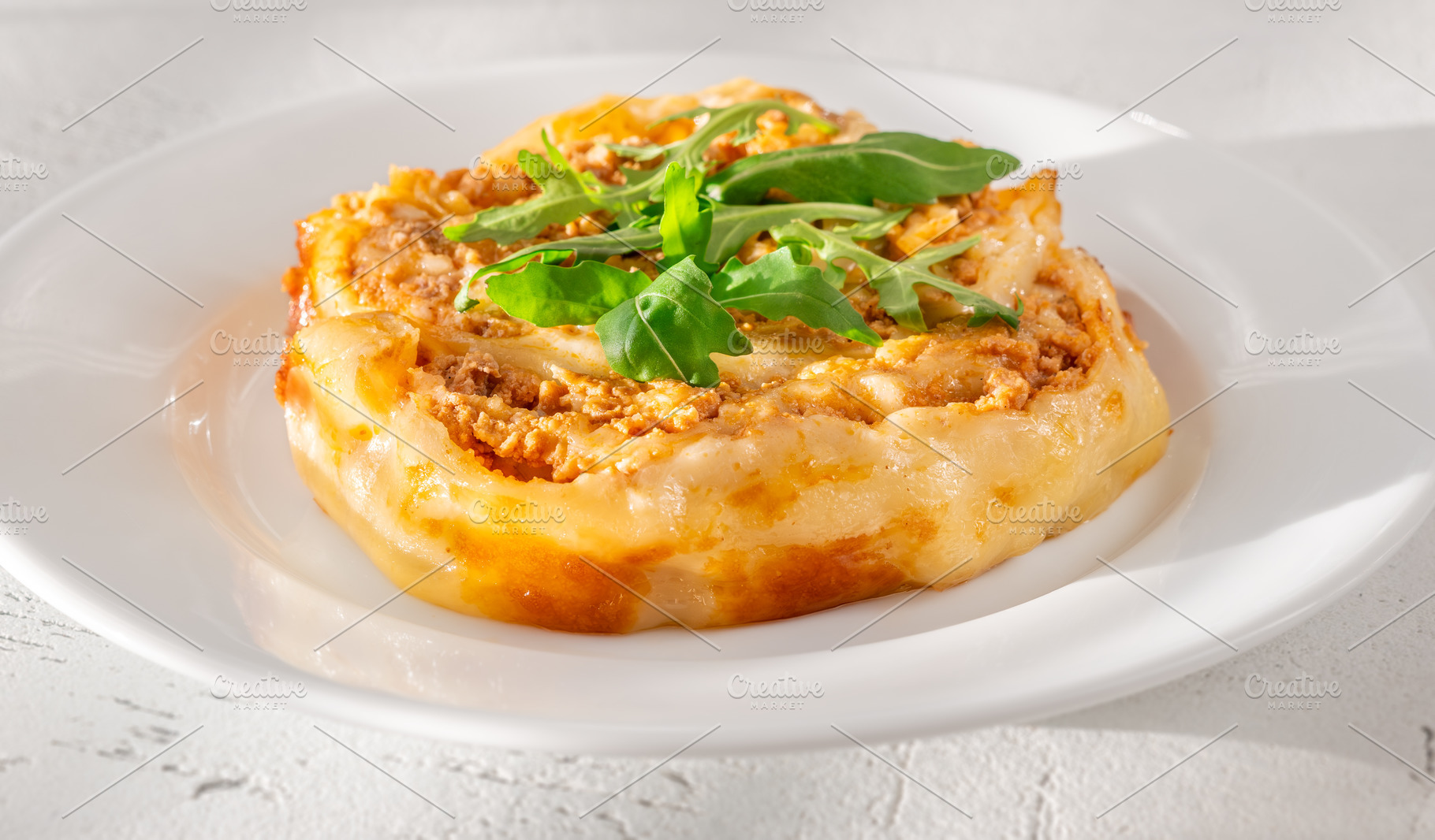 Circular lasagna, a Food & Drink Photo by Alexander Prokopenko