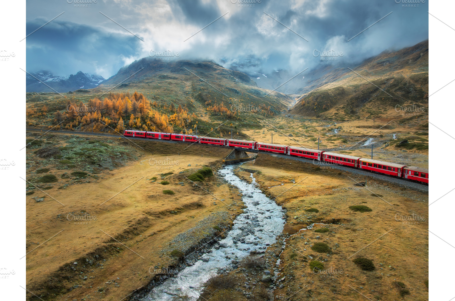 Aerial view of red train, river, a Transportation Photo by den-belitsky