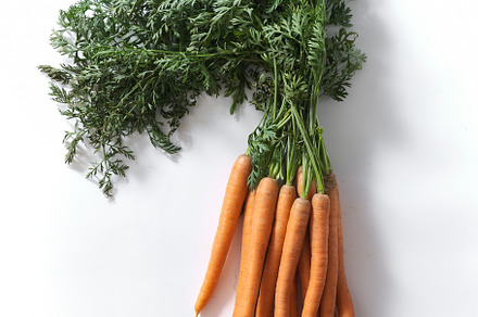 Flatlay with a bunch of fresh carrots with tops, a Food & Drink Photo by Asya Nurullina