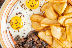 Golden potato dippers, fried eggs, a, a Food & Drink Photo by Alexander Prokopenko