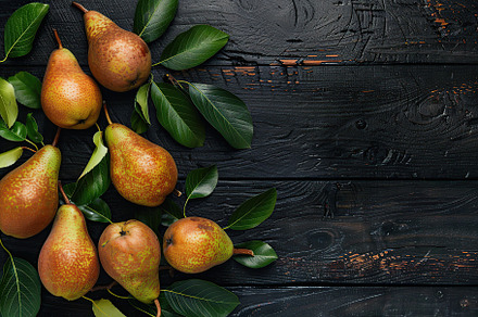 Red pears with leafs and copyspace for text on wooden table, a Food & Drink Photo by AlyaAnd