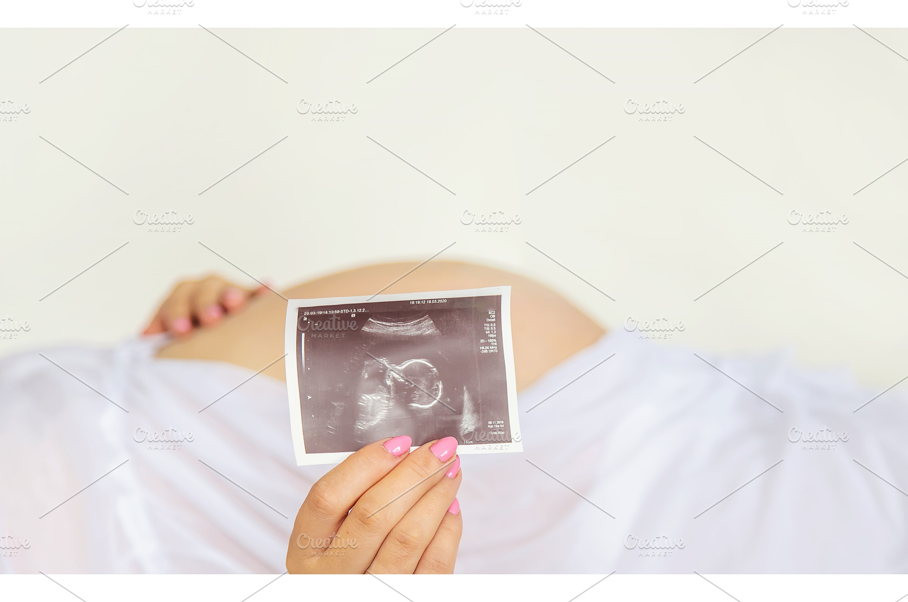 Pregnant woman with girl ultrasound, a Person Photo by yanadjana