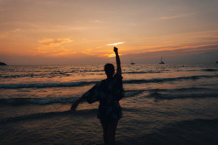 Summer sunset,Woman walking on the beach watching the sunset, a Nature Photo by Art Rachen