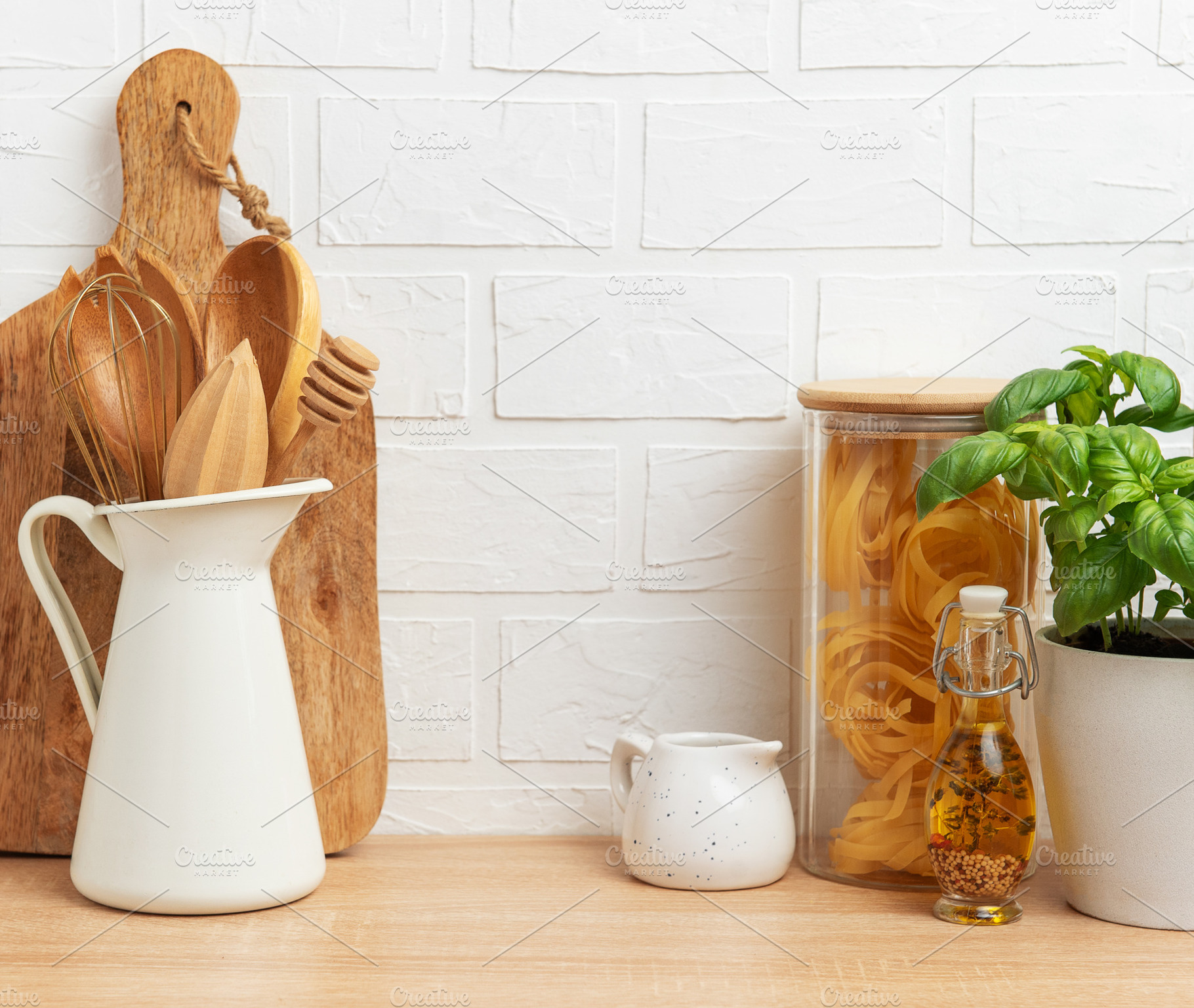 Kitchen utensils, pasta and basil showing rustic cooking and hea, a Food & Drink Photo by Olena Rudo