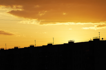 Golden sunset illuminating silhouette of city vertical, an Architecture Photo by RETROWAVE '88