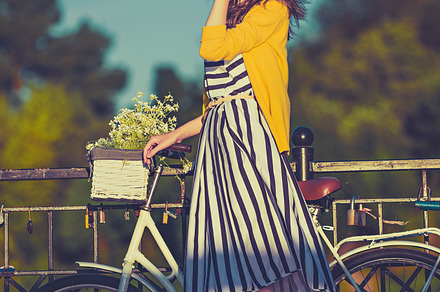 Girl on a bike ride with a retro hipster bike containing beautiful, bicycle, a Person Photo by Serovphoto