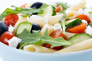 Mediterranean Pasta Salad with Fresh Vegetables and Herbs isolated on white bac, a Food & Drink Photo by etorres69