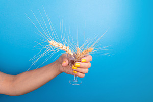 Woman's hand with yellow nails holding a crystal glass filled w, a Food & Drink Photo by Ales Munt