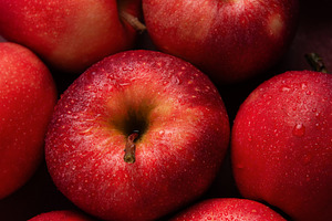 Fresh red apples forming appealing composition on dark backgroun, a Food & Drink Photo by Olena Rudo