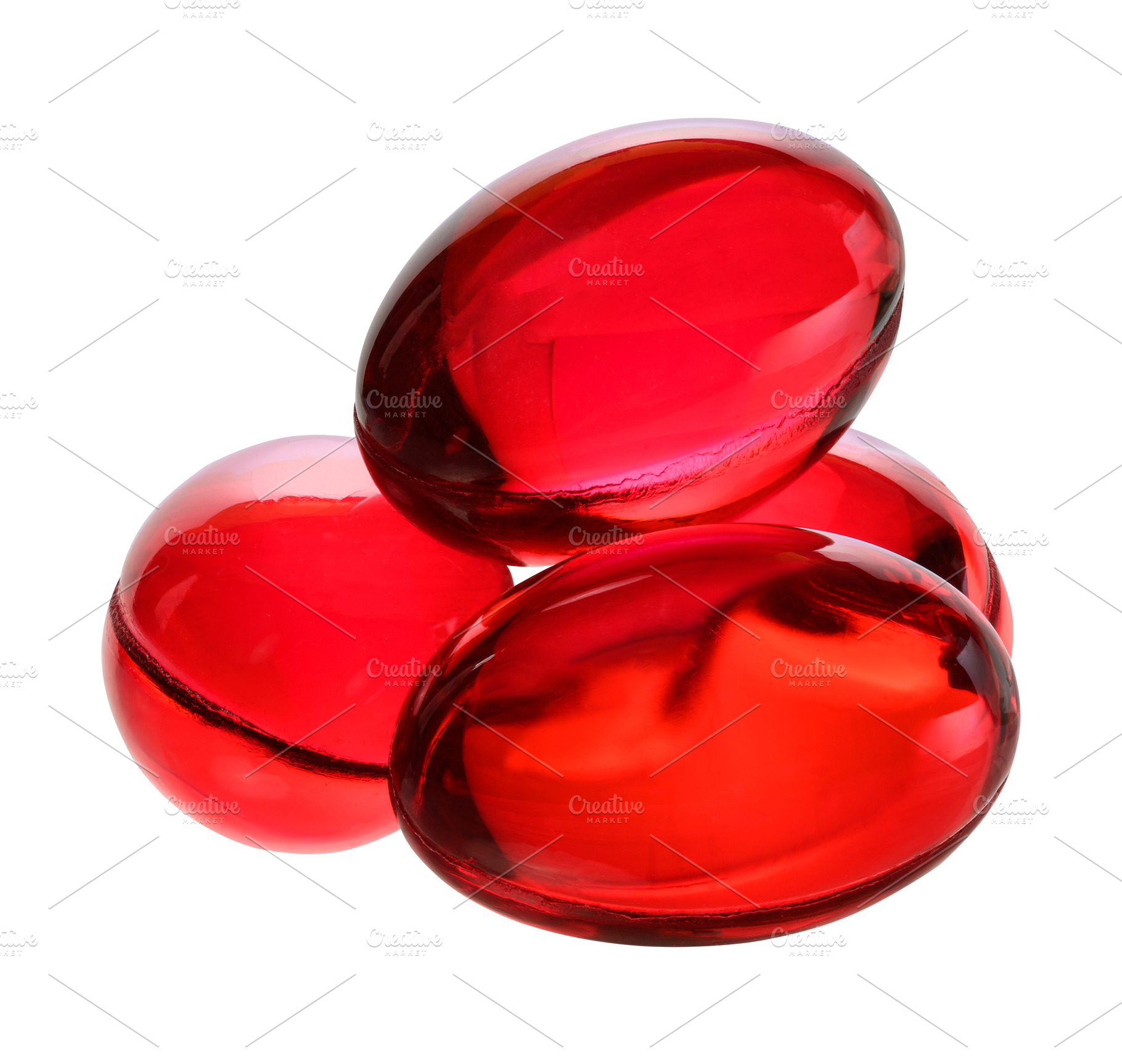 Several red gel capsules or vitamins on an isolated background., a Health & Medical Photo by ndanko