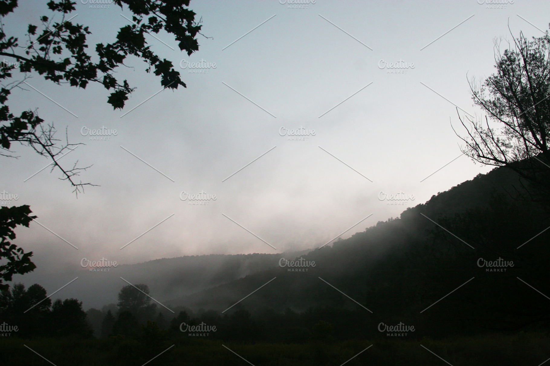 Misty mountains containing fog, mist, and misty, a Nature Photo by Paper City Design
